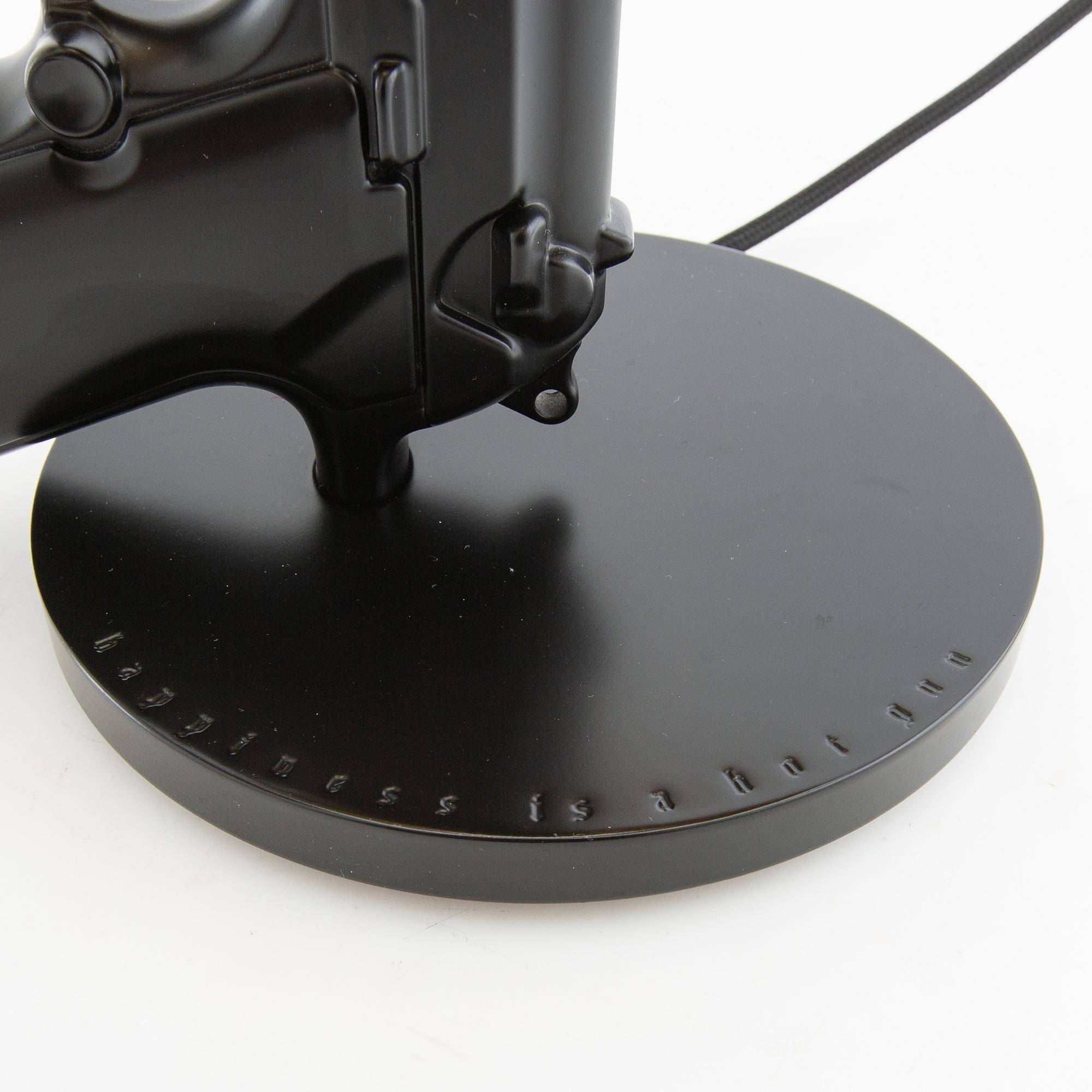 Philippe Starck, bordslampa, "Gun bedside Lamp", Flos, Italien.