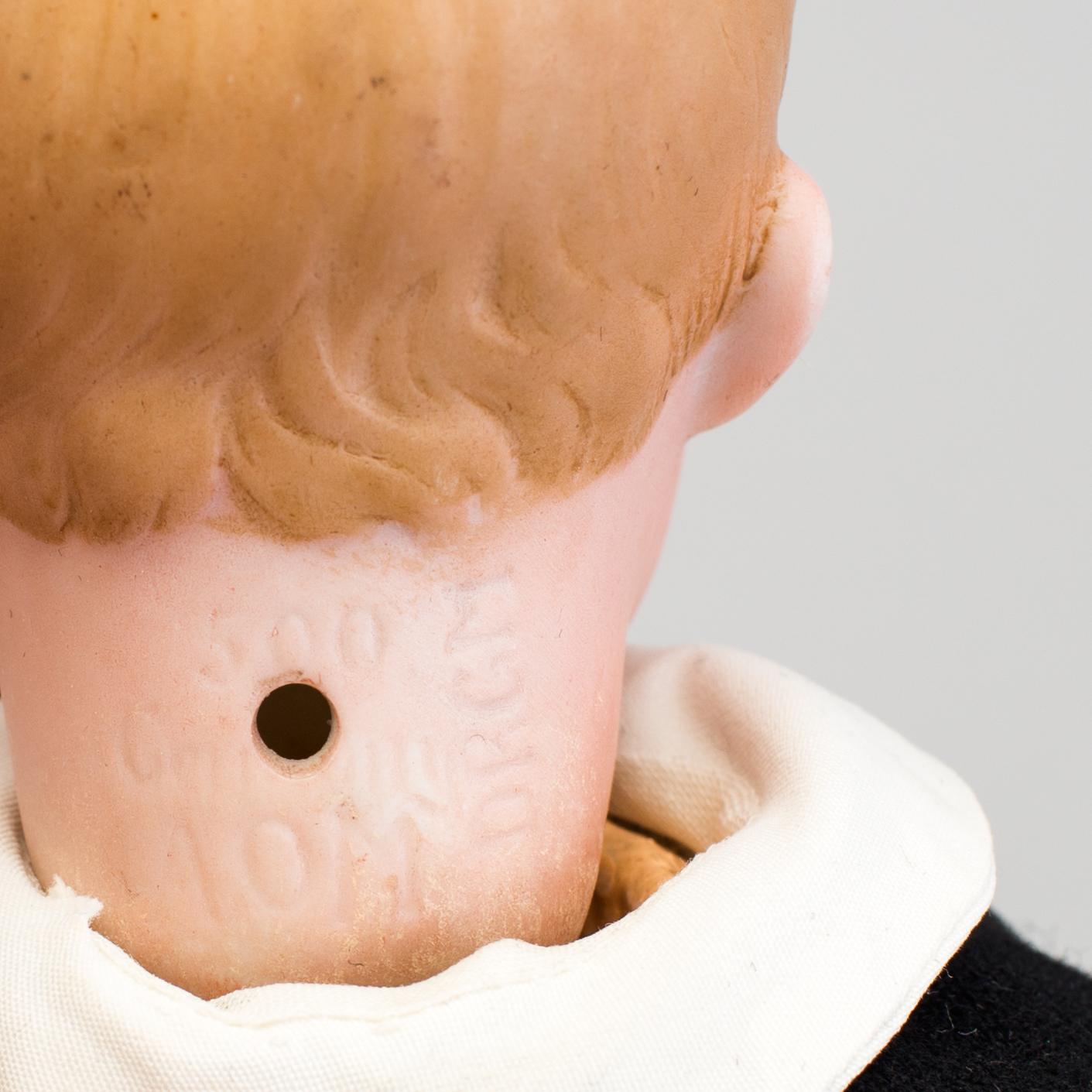A bisque headed character doll 500 by Armand Marseille, Germany, ca 1910.