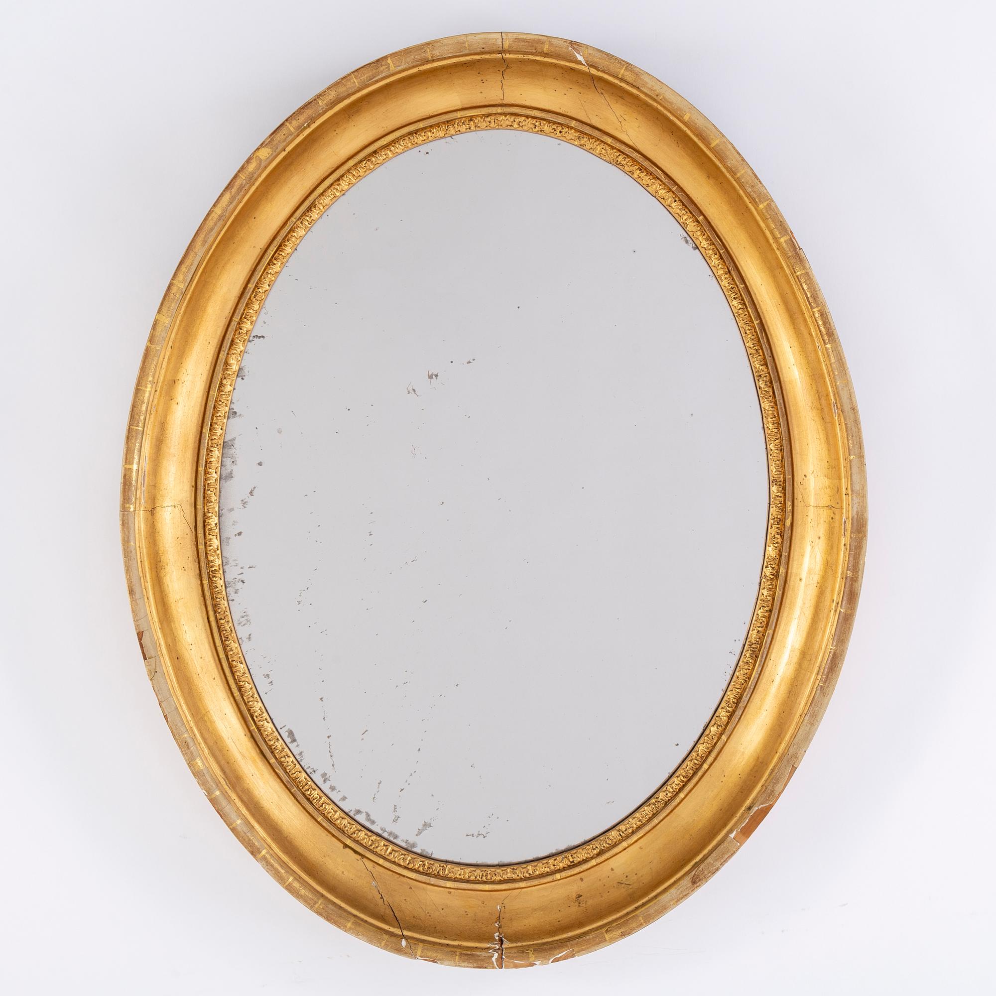 A gilt mirror, second half of the 20th Century.