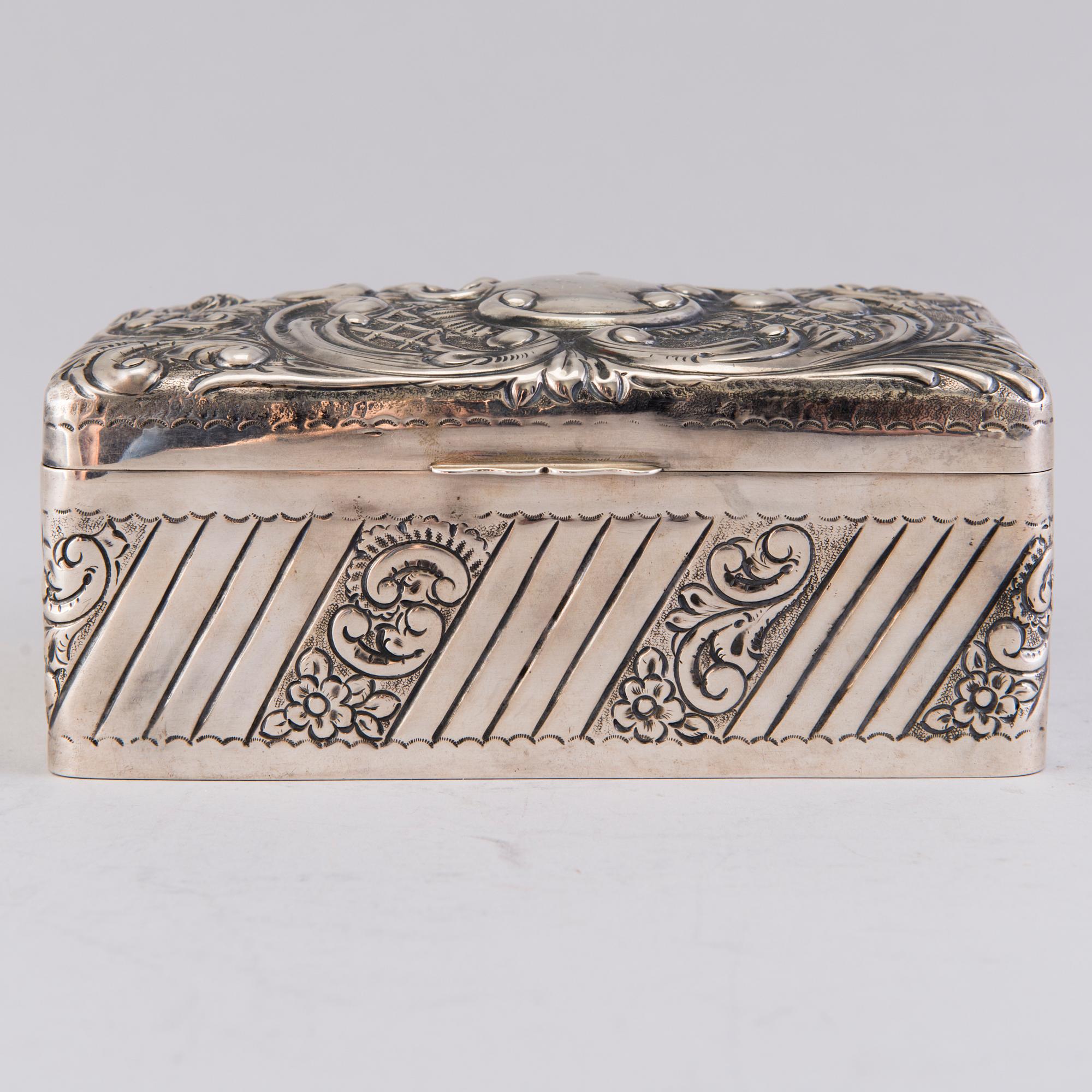 A silver cigar box, mark of A. & J. Zimmerman, Birmingham 1897.