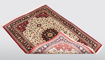 A carpet, Silk Qum, ca 116 x 75 cm.