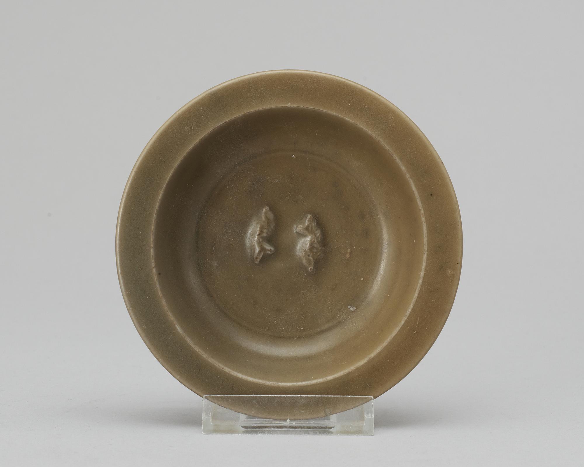 A celdon glazed dish with double fishes, Yuan/Ming dynasty.