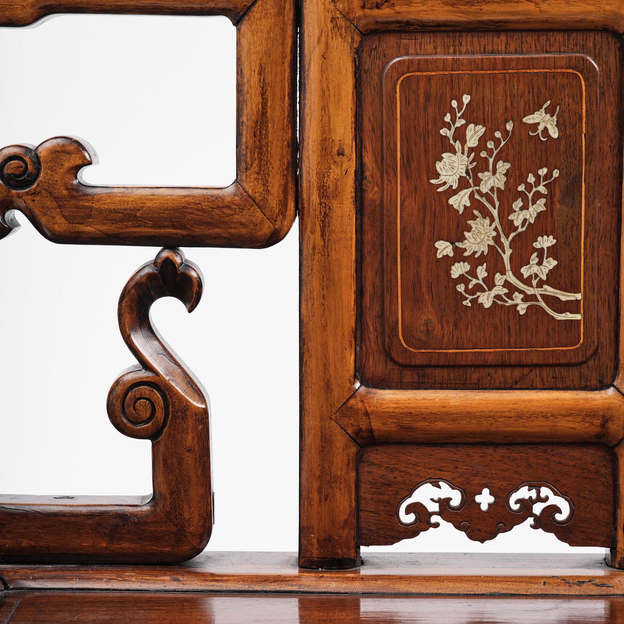 A pair of hardwood armchairs, late Qing dynasty.
