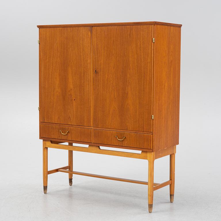 A teak veneered cabinet, mid 20th Century.