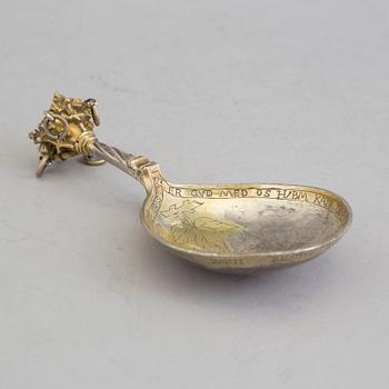 A Nordic parcel-gilt silver spoon dated 1586.