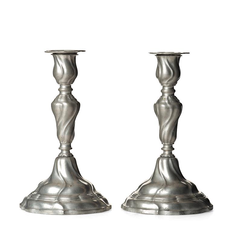 A pair of Swedish Rococo pewter candlesticks by E P Krietz, made in Stockholm 1772.