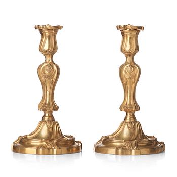 78. A pair of French Louis XV mid 18th century gilt bronze candlesticks.