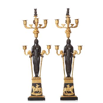 A pair of Russian Retour d'Egypte Empire Alexander I five-light candelabra, St. Petersburg.