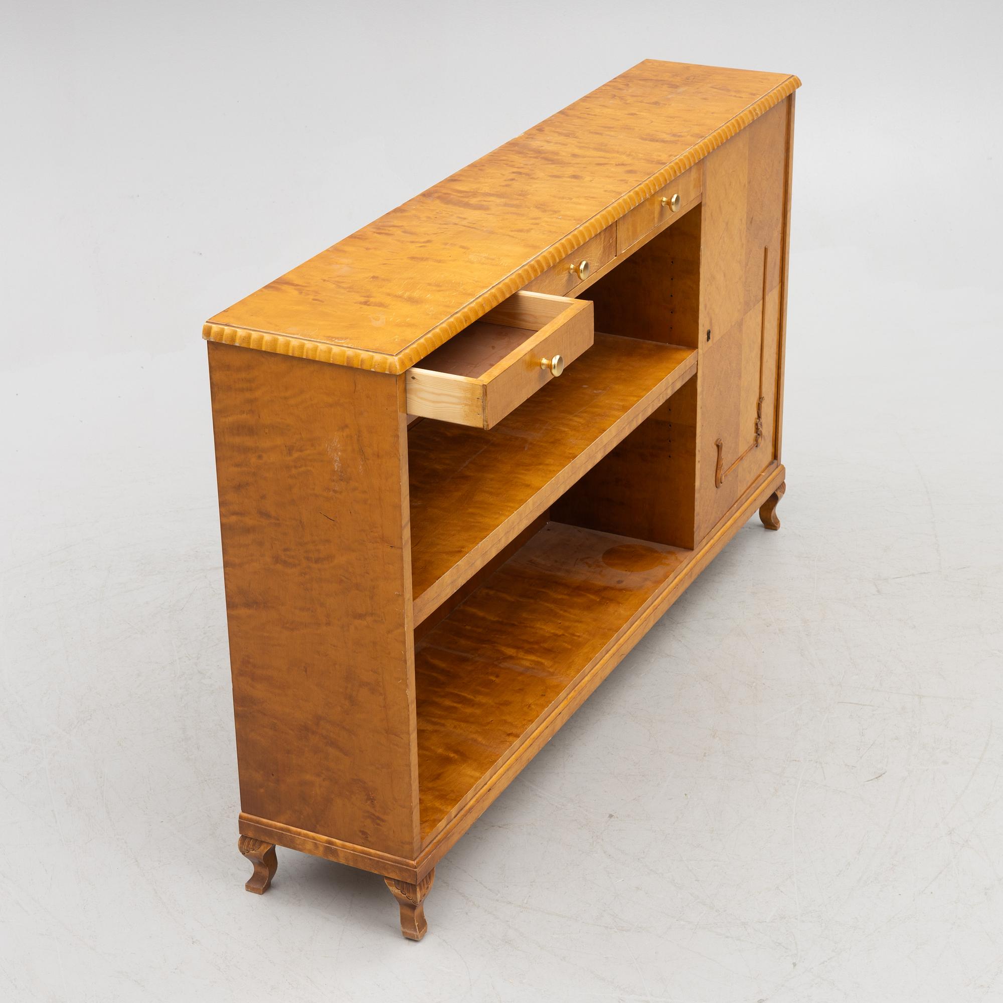 A bookcase with cabinet, 1940's.