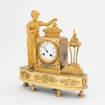 A French Empire gilt bronze mantle clock, early 20th Century.
