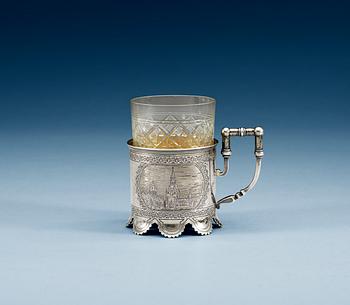 A RUSSIAN PARCEL-GILT TEA-GLASS HOLDER, un identified makers mark, Moscow 1884.