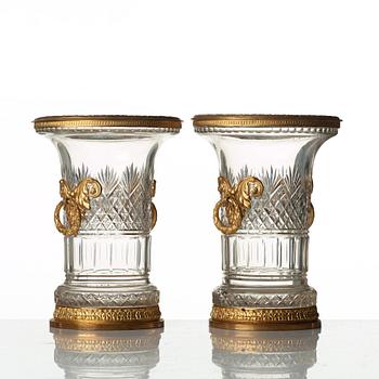 A pair of Empire-style circa 1900 cut glass and gilt-brass urns.