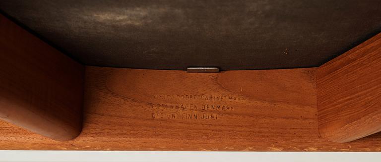 Finn Juhl, a teak and natural brown leather "Chieftain Chair" by Niels Vodder, 1950-60's.