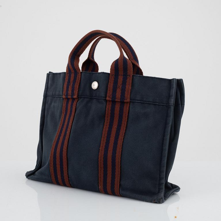 Hermès, "Fourre tout PM" bag and toiletry bag.
