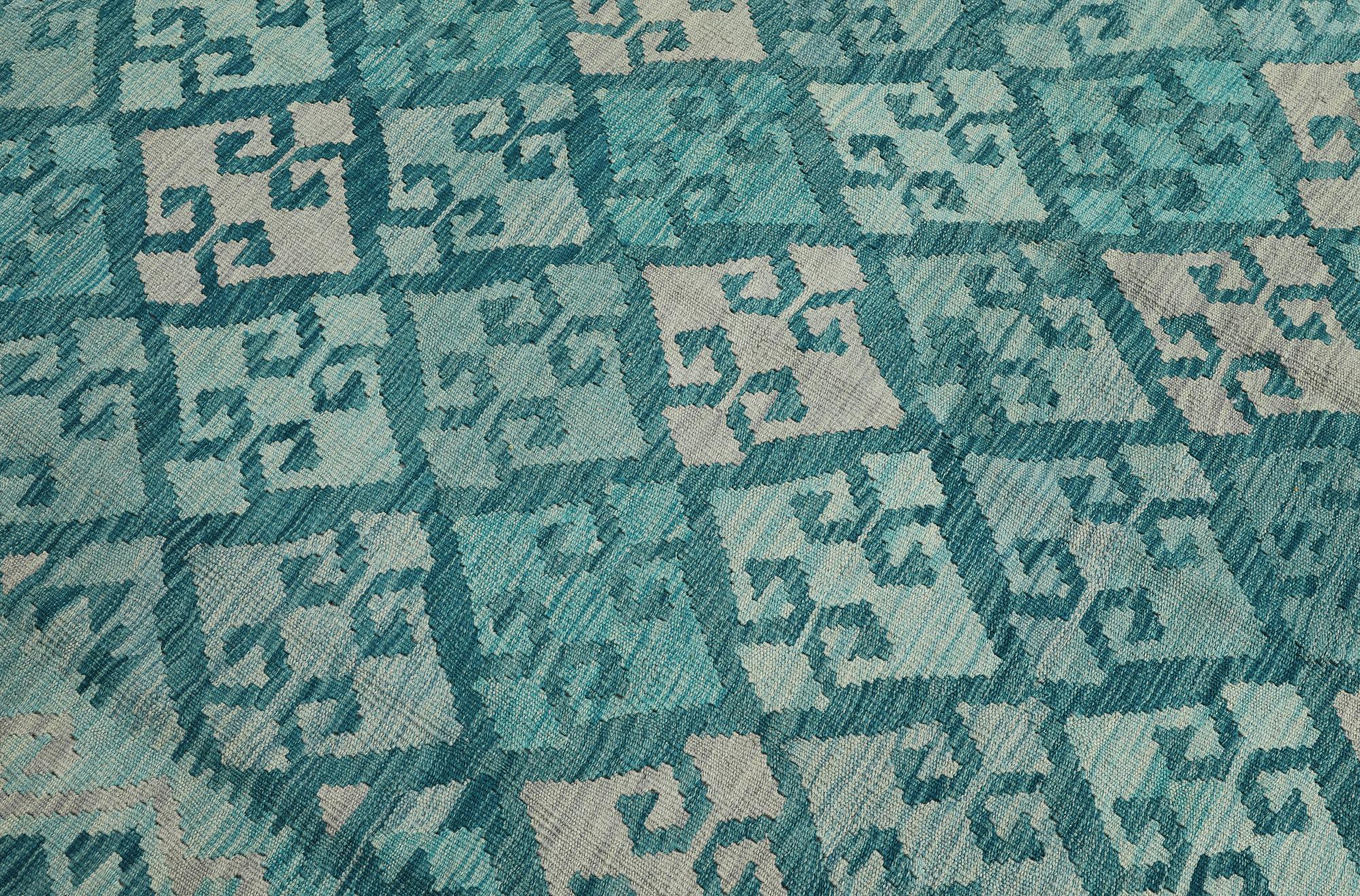 A Kelim carpet, 350 x 245 cm.