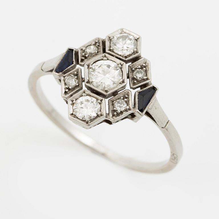 A platinum ring set with round brilliant-cut diamonds and sapphires, Art Déco.