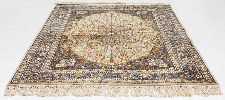A Tabriz rug, a. 214 x 137 cm.
