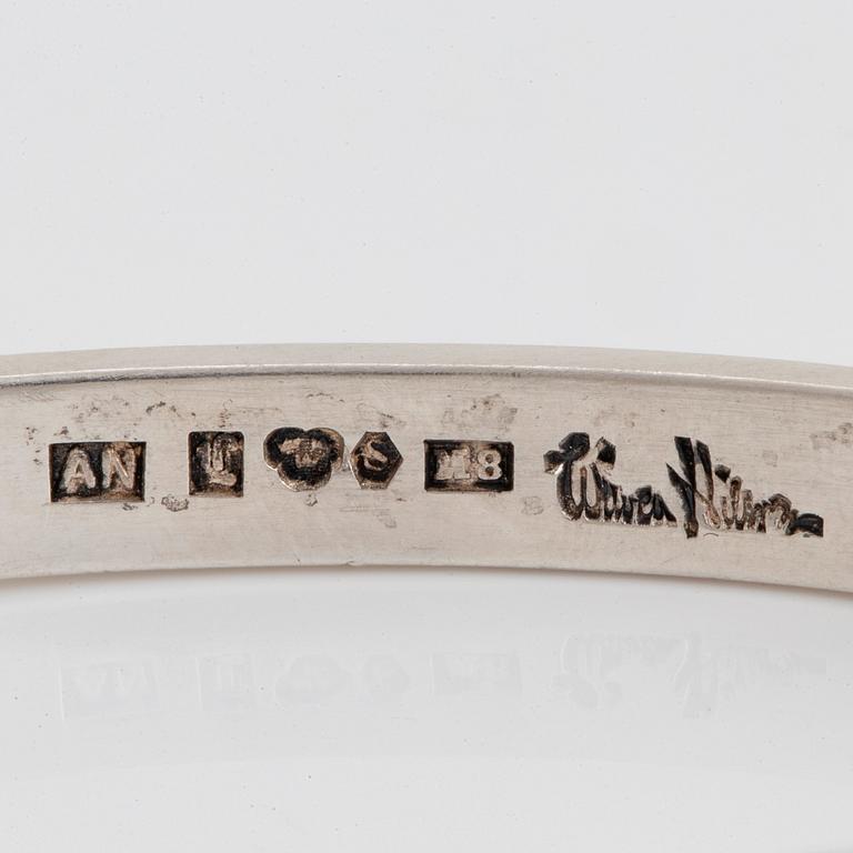 Wiwen Nilsson, a sterling silver bangle with three cabochon cut moonstones, Lund, Sweden 1938.