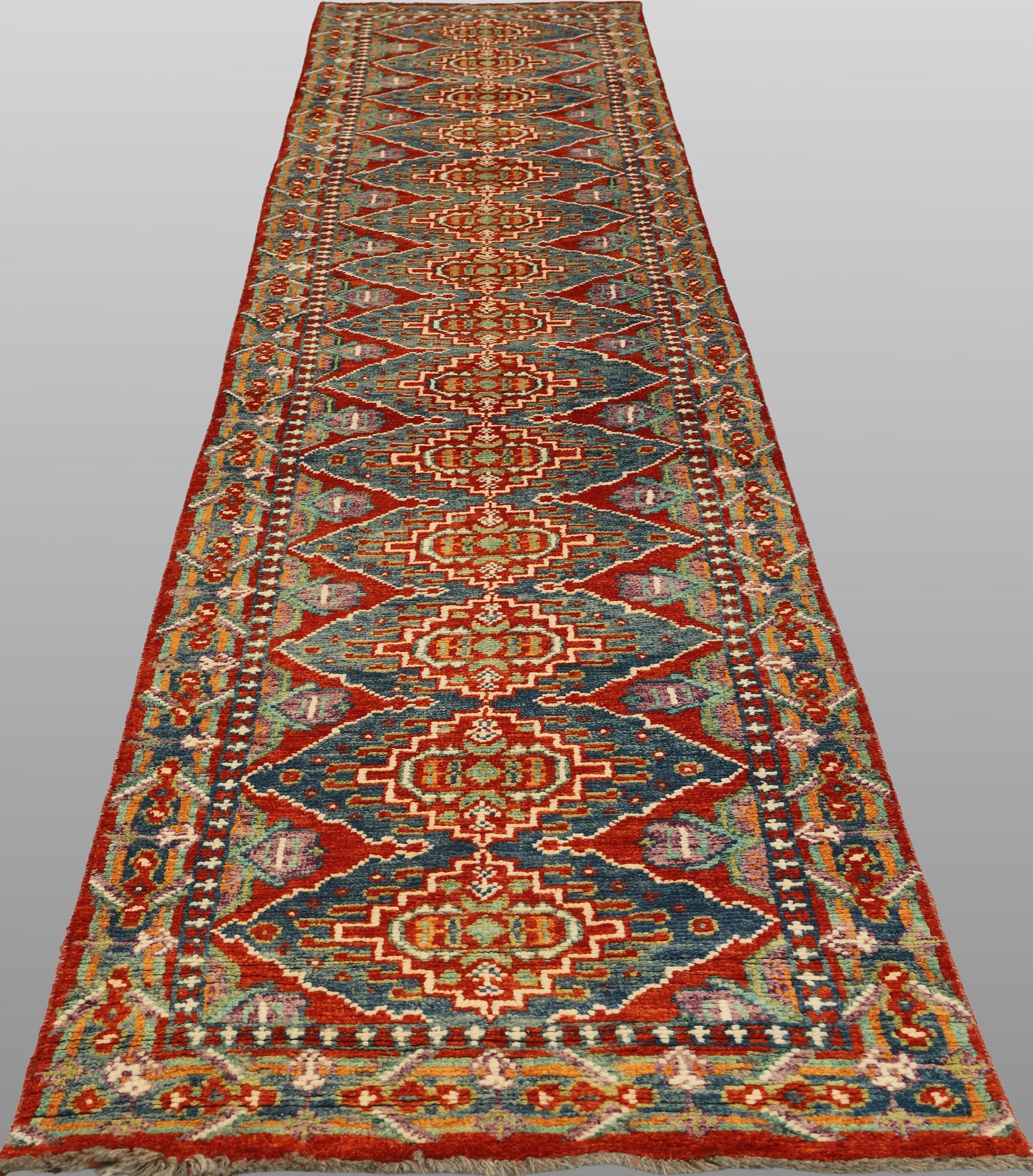 An oriental runner, c. 386 x 78 cm.