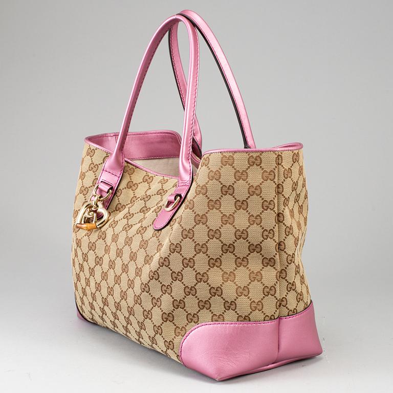 GUCCI, a monogram canvas and pink metallic leather handbag.