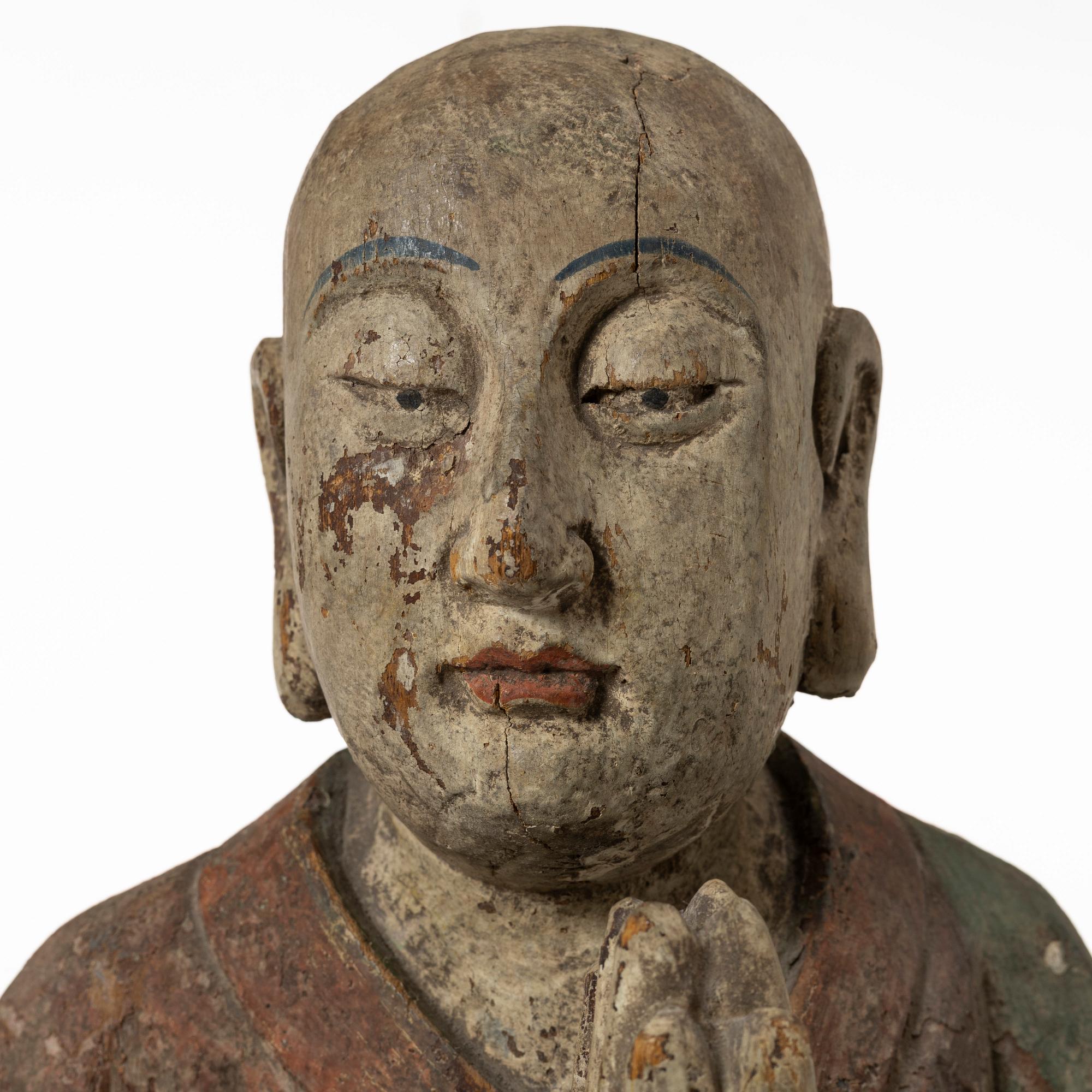 A Chinese sculpture of a louhan, 20th century.