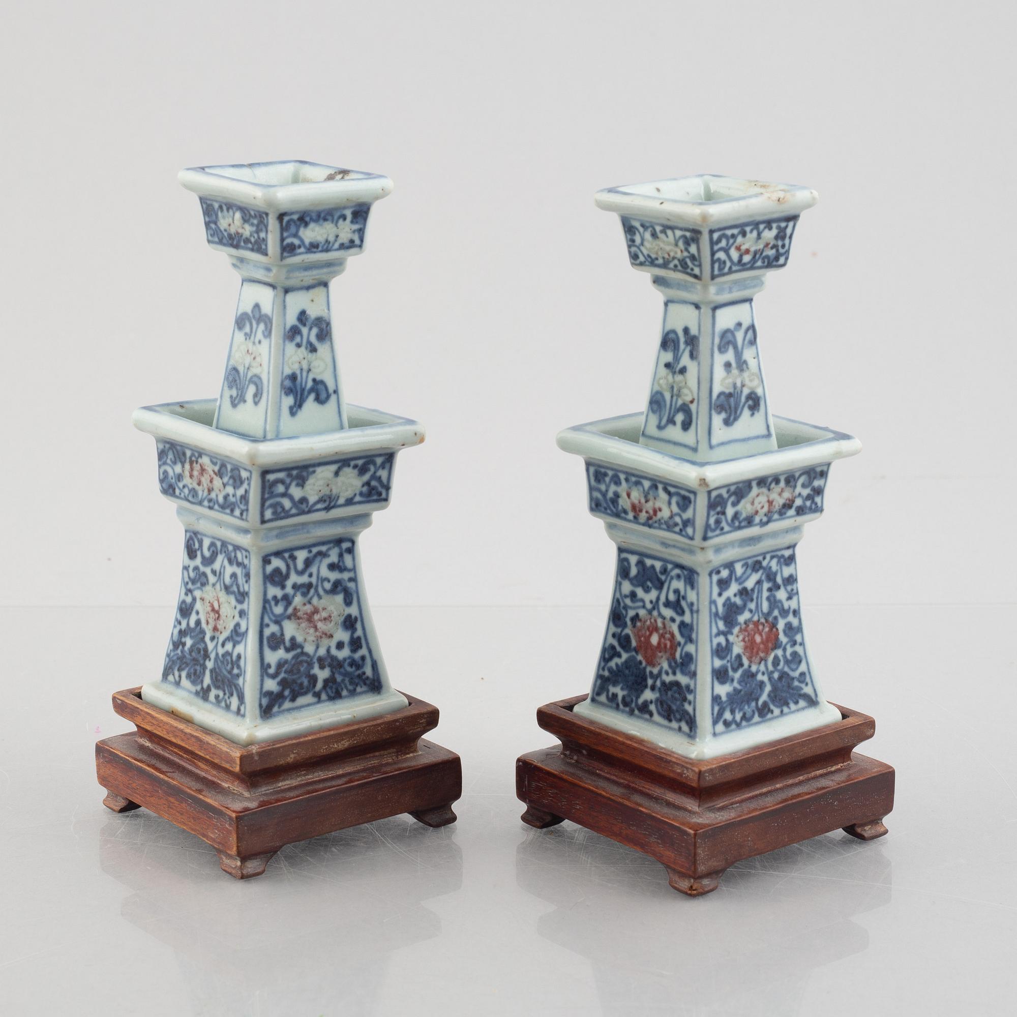 A pair of Chinese porcelain altar sticks, late Qing dynasty.