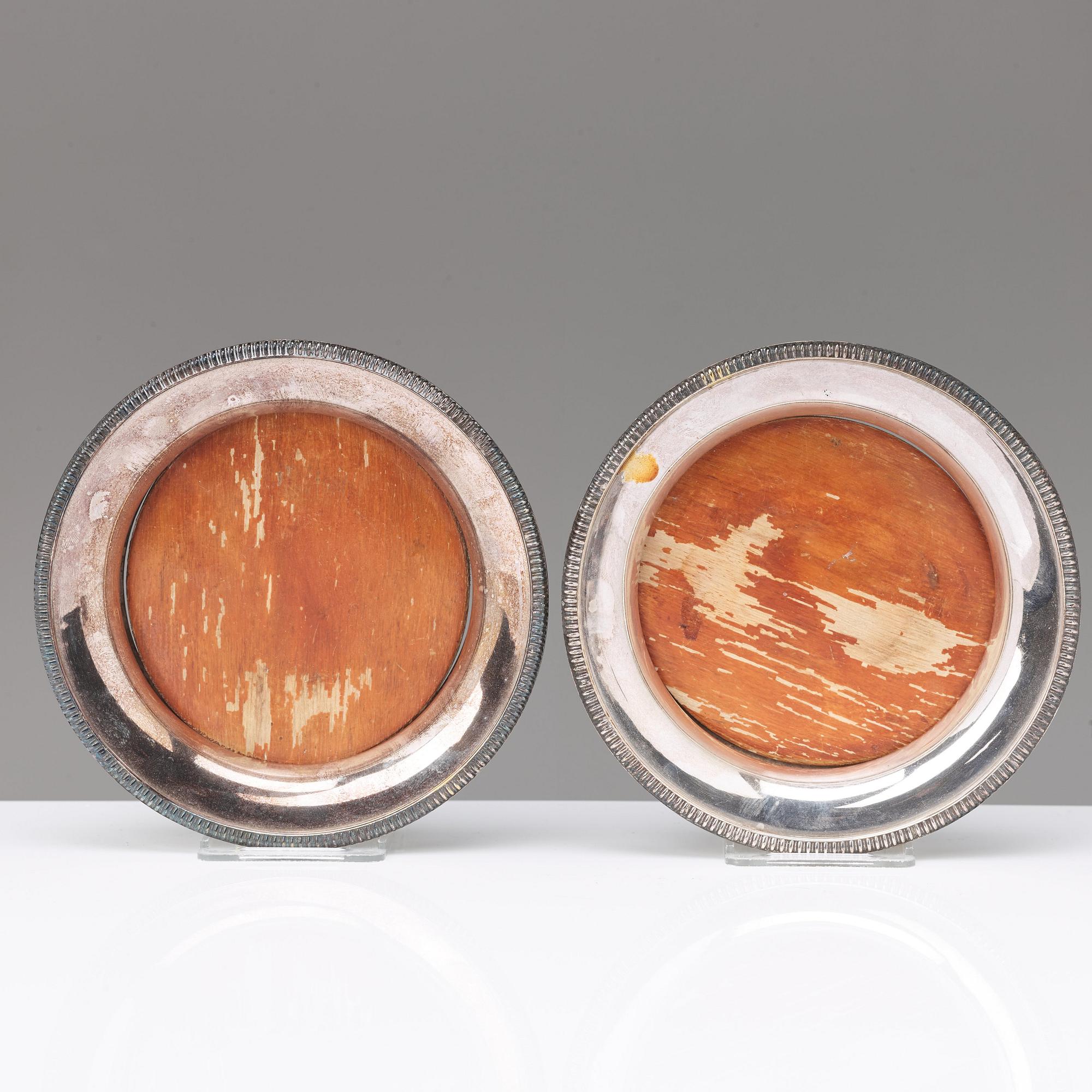 A pair of 20th century coasters, white metal and an English silver plated salt-cellar and A 20th c glass table-bell.