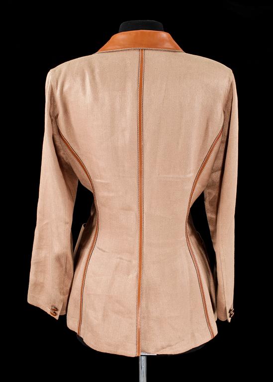 A beige linen jacket by Hermès.