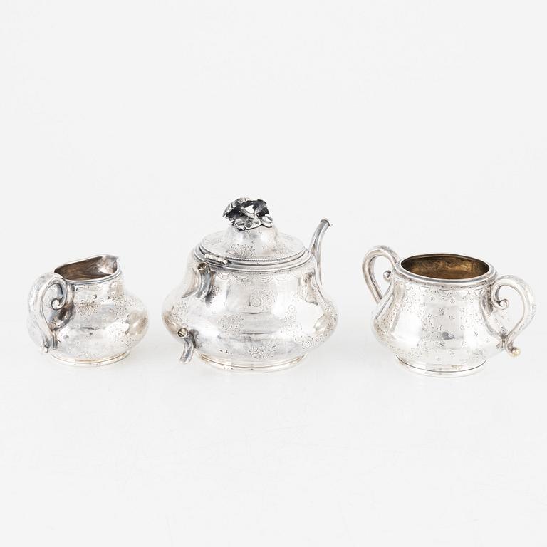 A Silver Teapot, Sugar Bowl and Creamer, France and England, 19th Century.