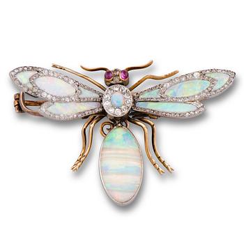 A BROOCH, opal, diamonds, rubies, platunum and gold, turn of the 20th century.