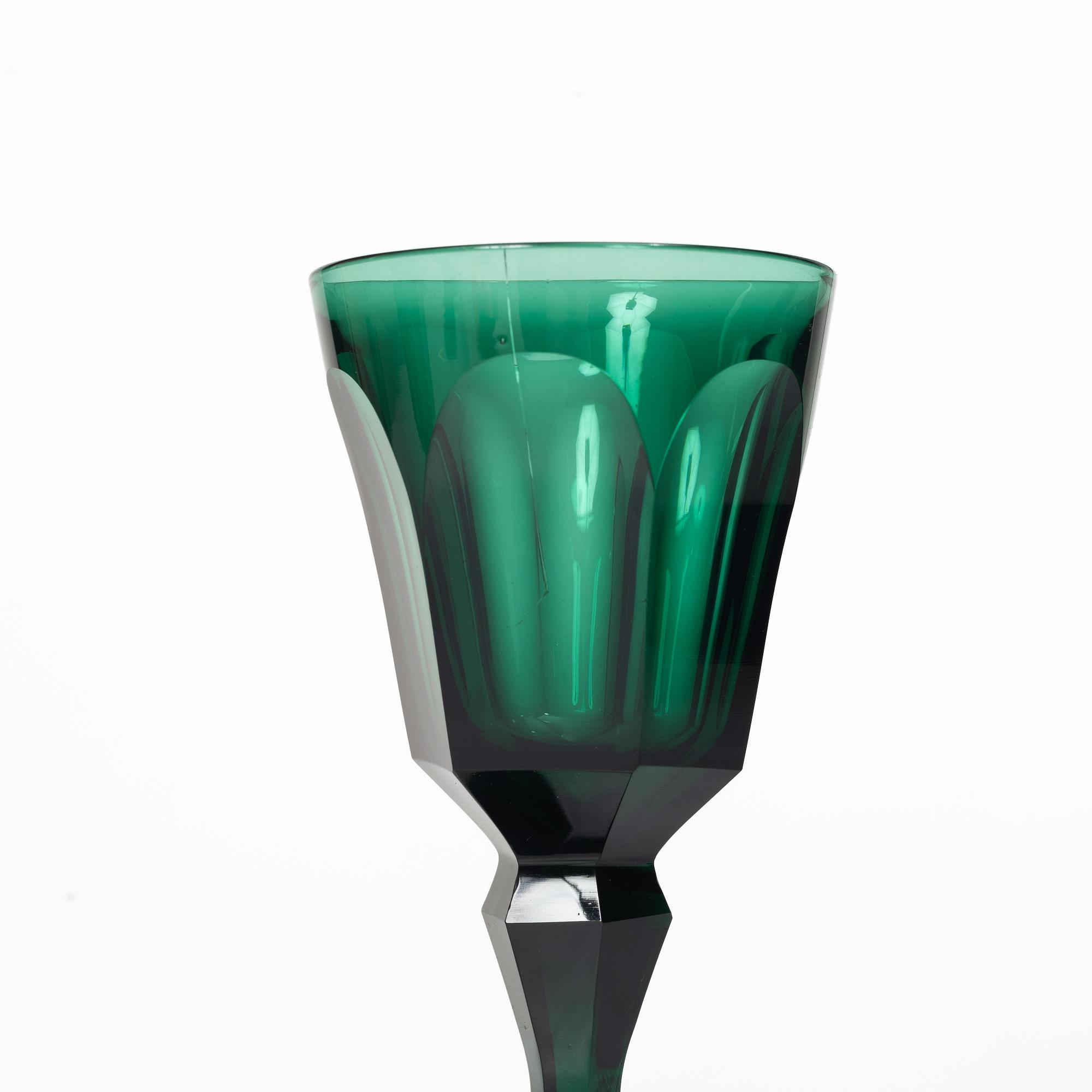 Eleven white wine glasses, green, 19th century.