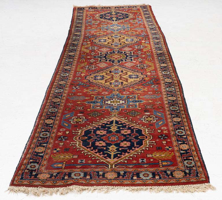 A semi-antique Kurdish runner, 350 x 140 cm.