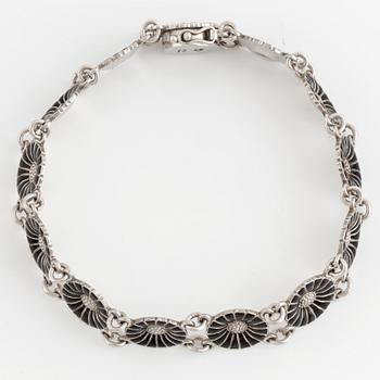 SMYCKESGARNITYR, 4 delar, Georg Jensen, 'Daisy,' sterlingsilver och svart emalj.