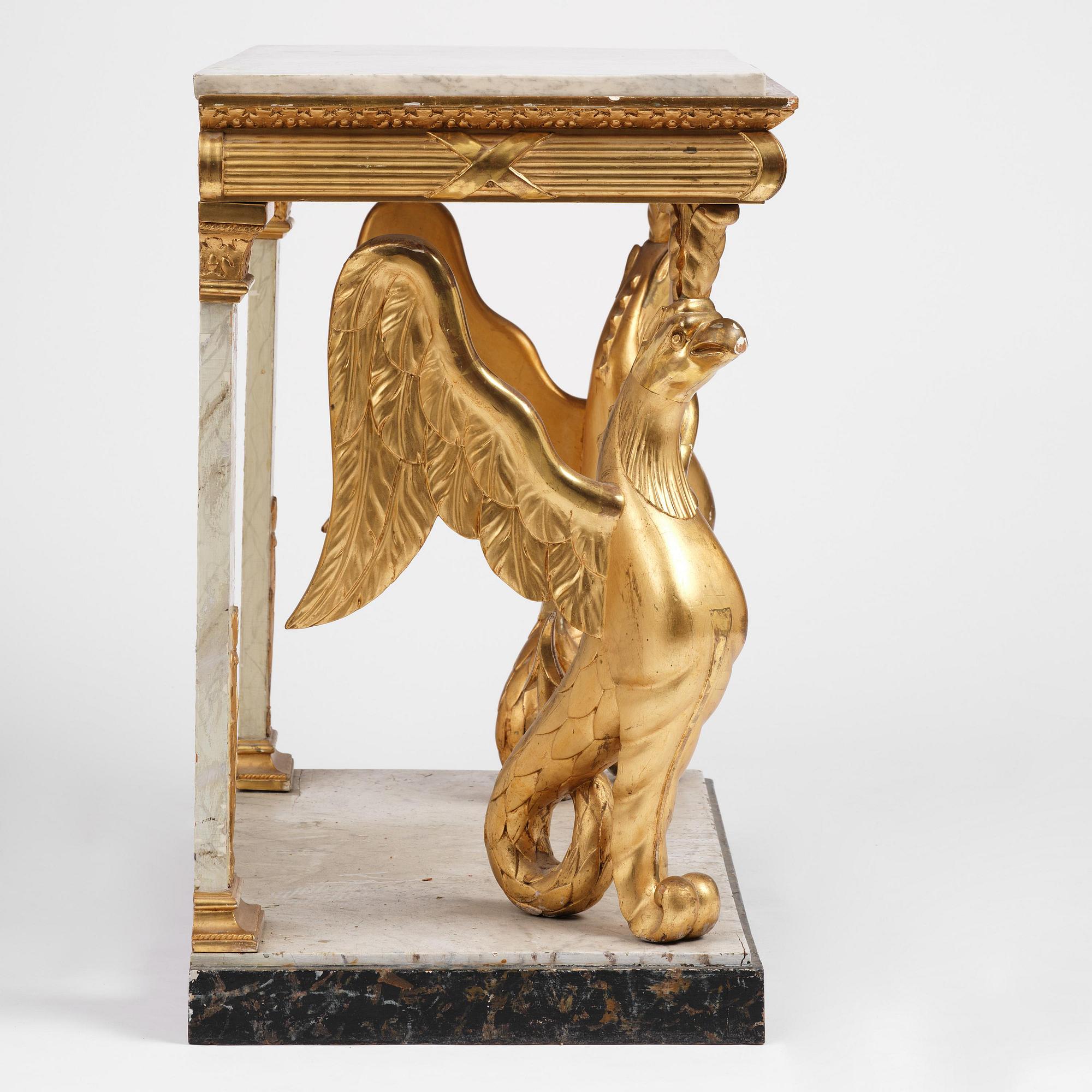 A Swedish Empire gilt wood and white marbel console table.