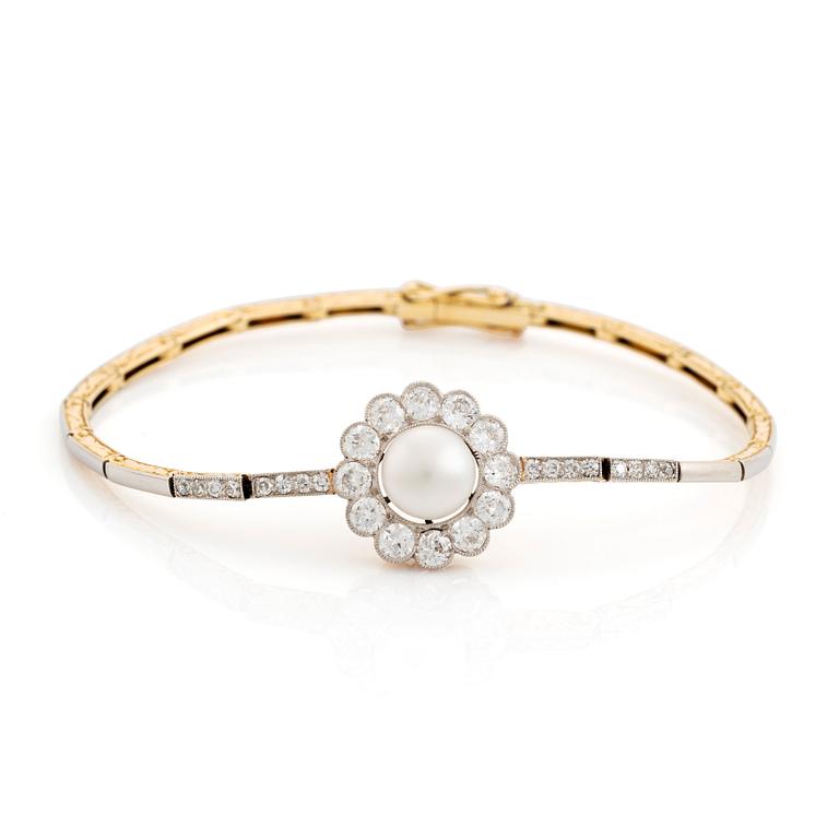 A gold and platinum bracelet with a bouton pearl and set with old- and eight-cut diamonds.