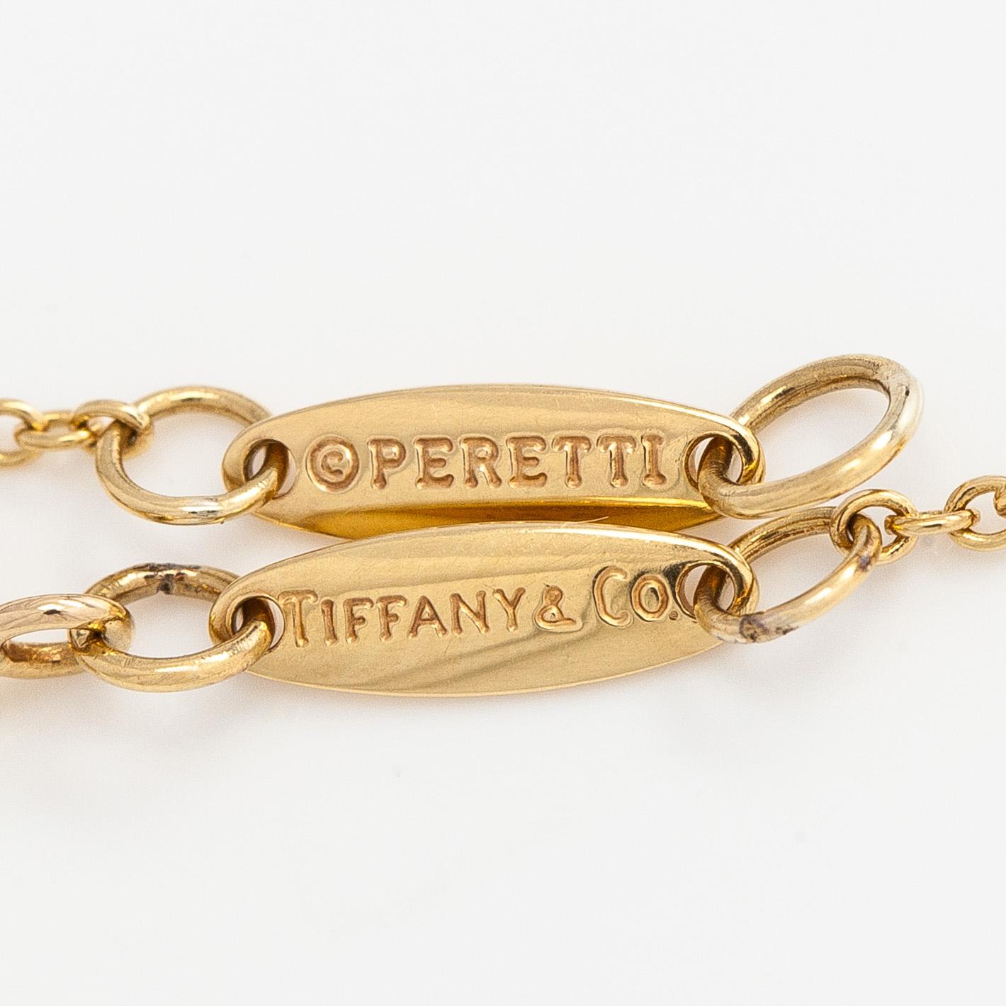 Tiffany & Co, Elsa Peretti, an 18K gold "Teardrop" necklace with a rock crystal pendant.