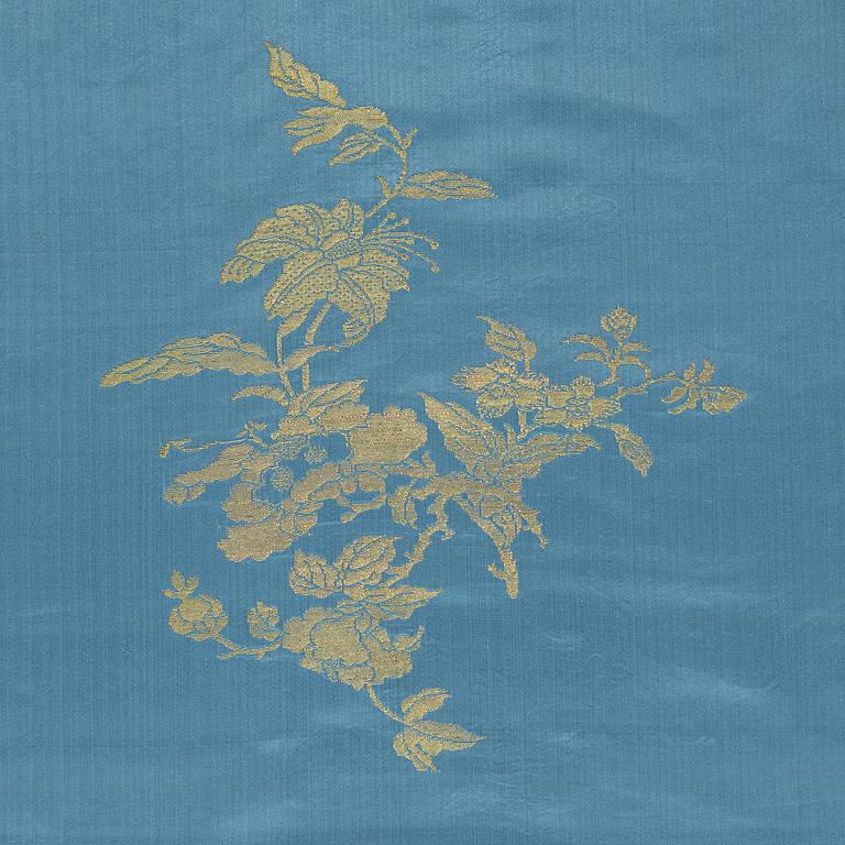 A bolt of Chinese pale blue and gold silk fabric, early 20th century.