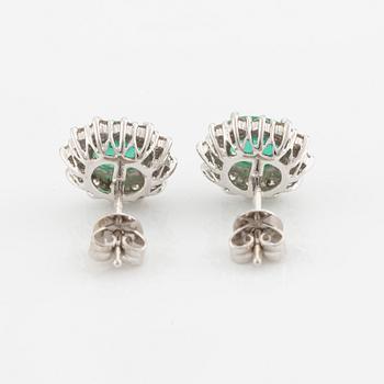 Earrings, one pair, 18K white gold with emeralds and brilliant-cut diamonds.