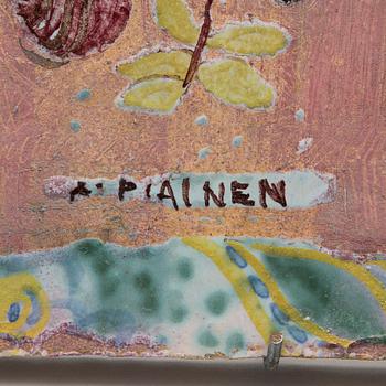 A stoneware plaquet signed Kaipiainen.