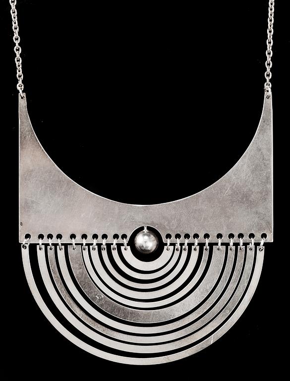 Tapio Wirkkala, A Tapio Wirkkala sterling pendant 'Half-Moon' and chain by Nils Westerback, Helsinki 1972.