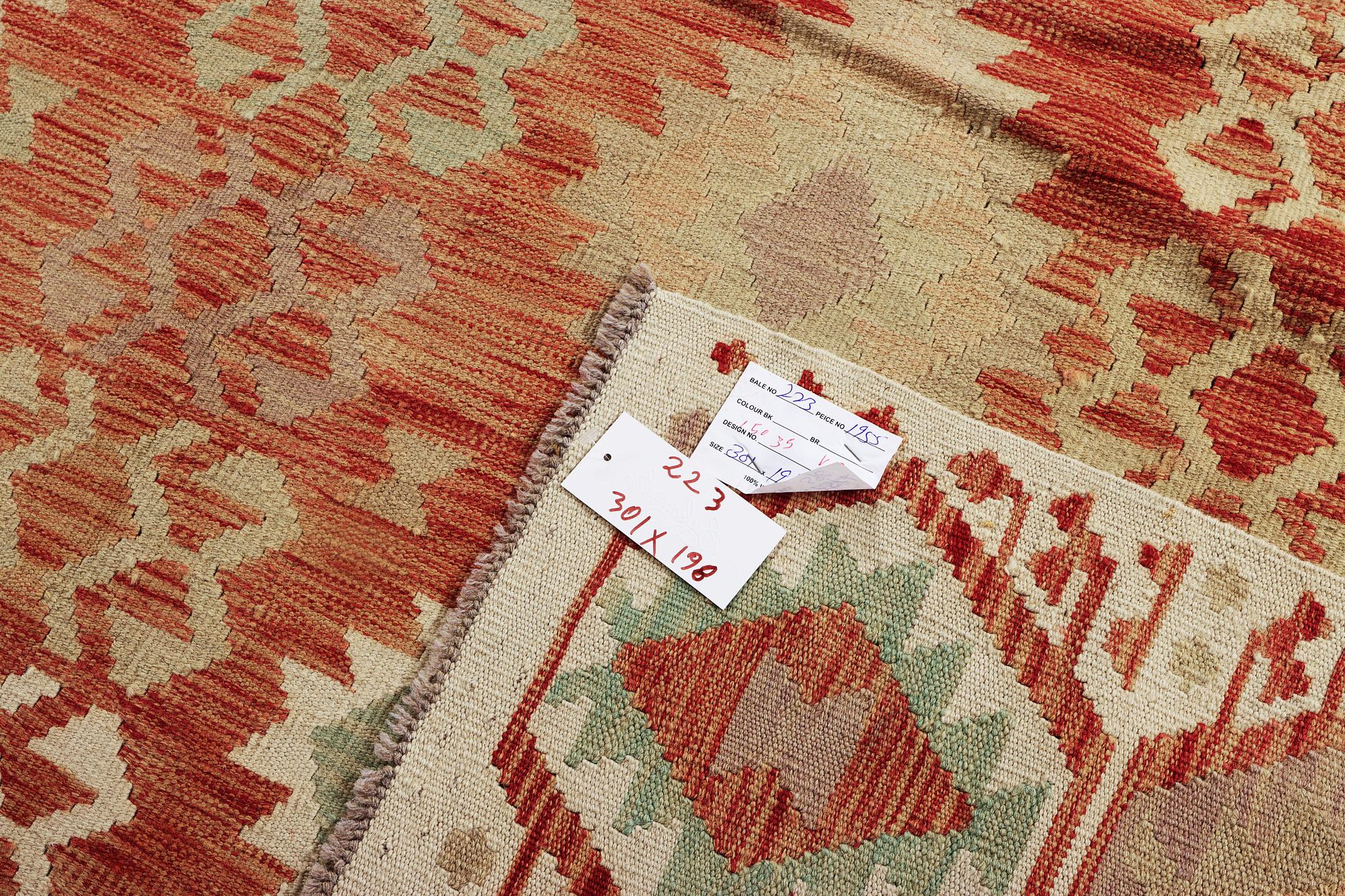A Kilim carpet, c. 301 x 198 cm.