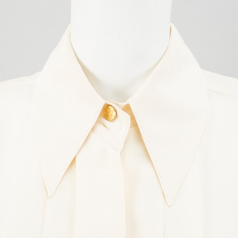 A Crepe de Chine Cream Coloured Silk Blouse by Chanel.