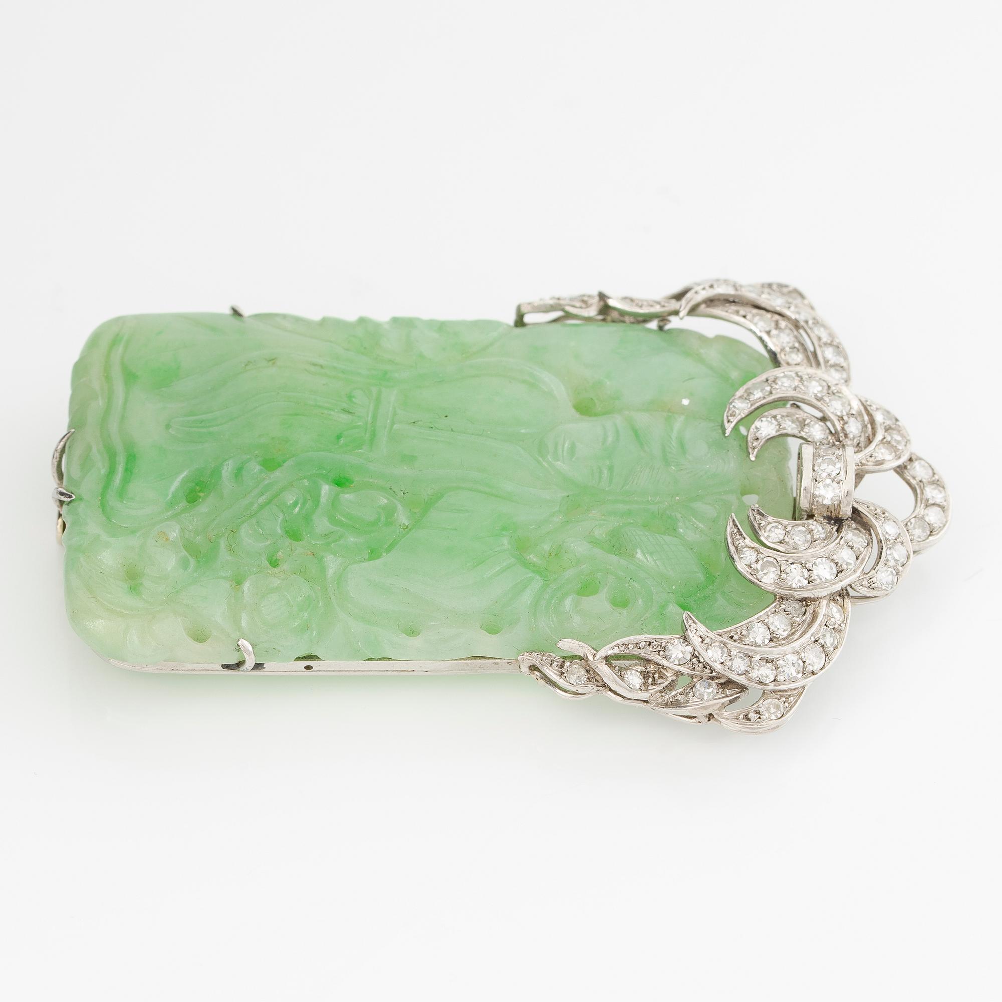 Brooch, platinum with carved jade and octagon-cut diamonds.