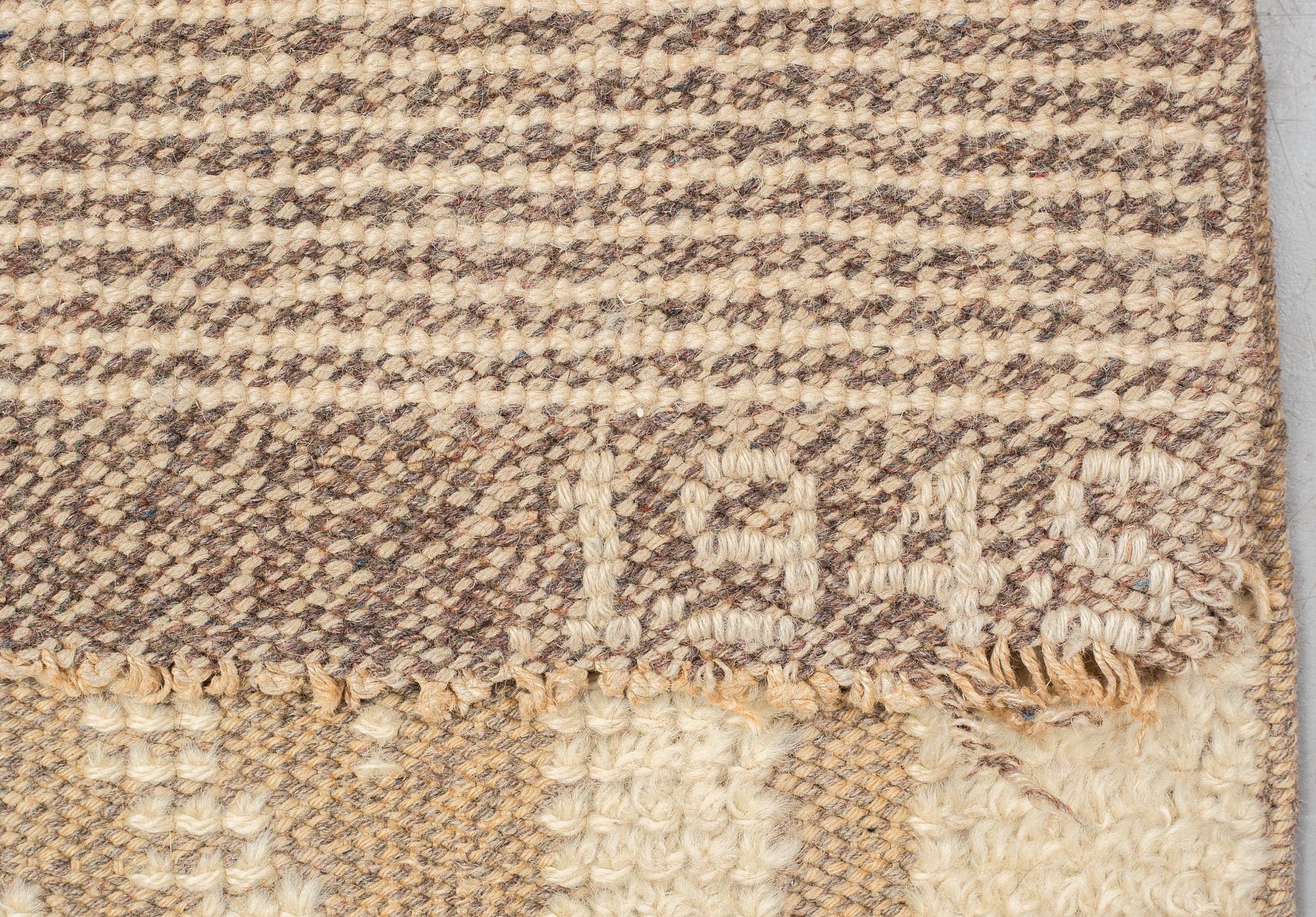 matto, knotted pile in relief, ca 187,5-189,5 x 96,5-100 cm, signed and dated S.K.L.H. 1945 at the back.