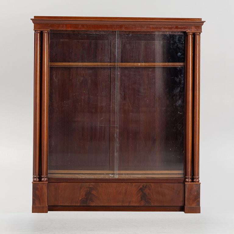An Empire style bookcase, first half of the 20th Century.