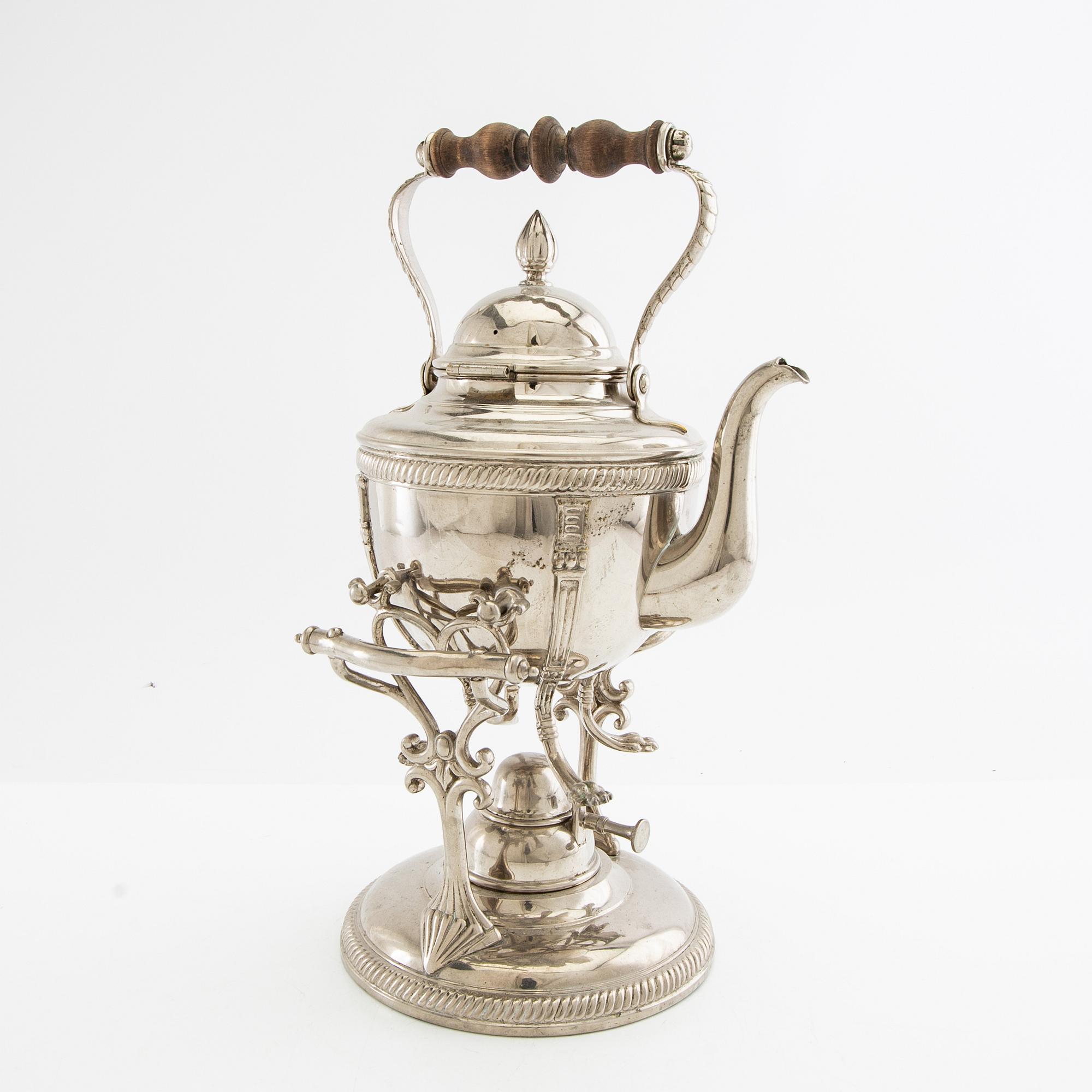 Tea kettle with a burner around 1900.