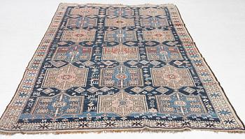 A Caucasian rug, c. 320 x 160 cm.