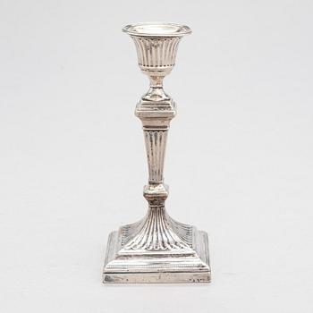 A late 19th-century sterling silver candlestick, maker's mark of William Hutton & Sons, London 1893.