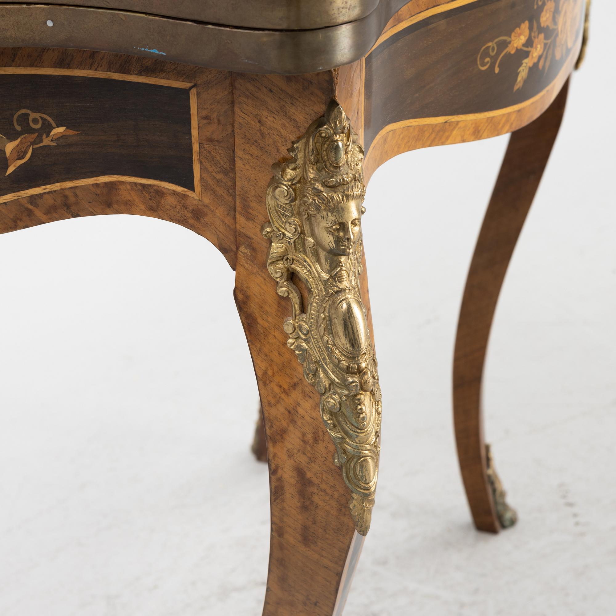 A Louis XV-style games table, early 20th century.