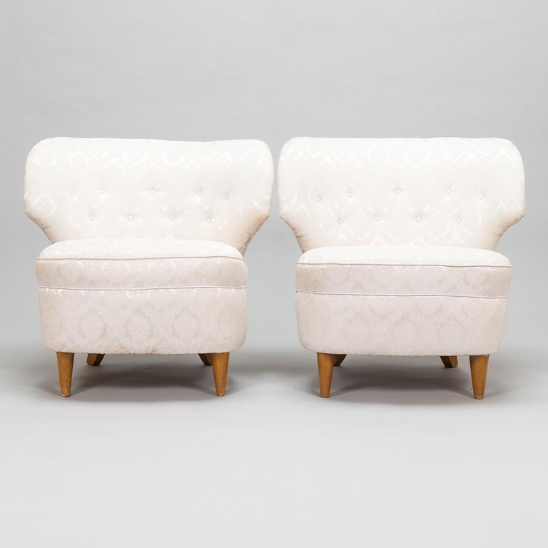A pair of 1950's armchairs.